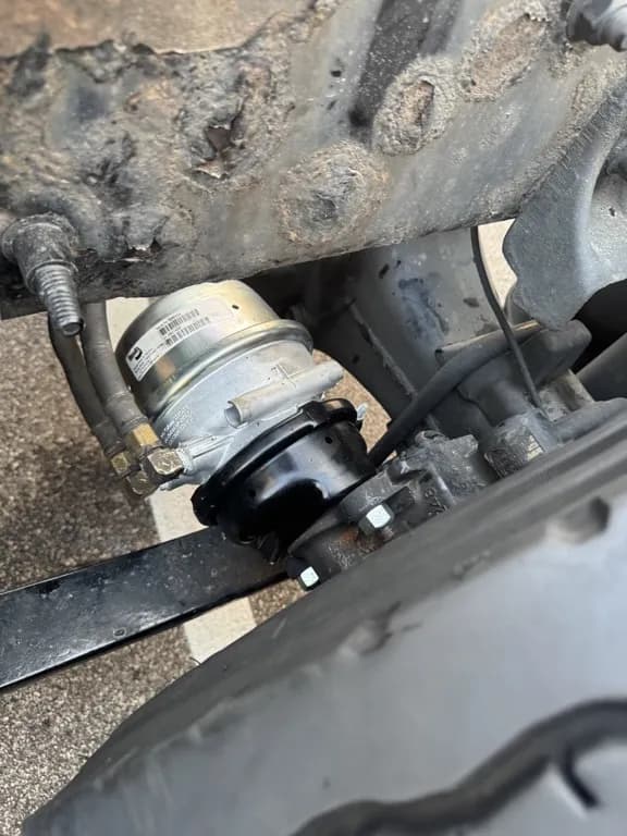 New brake chamber installed on a commercial truck axle