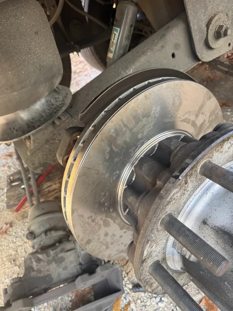 Brake rotor and hub with wheel removed for truck brake repair